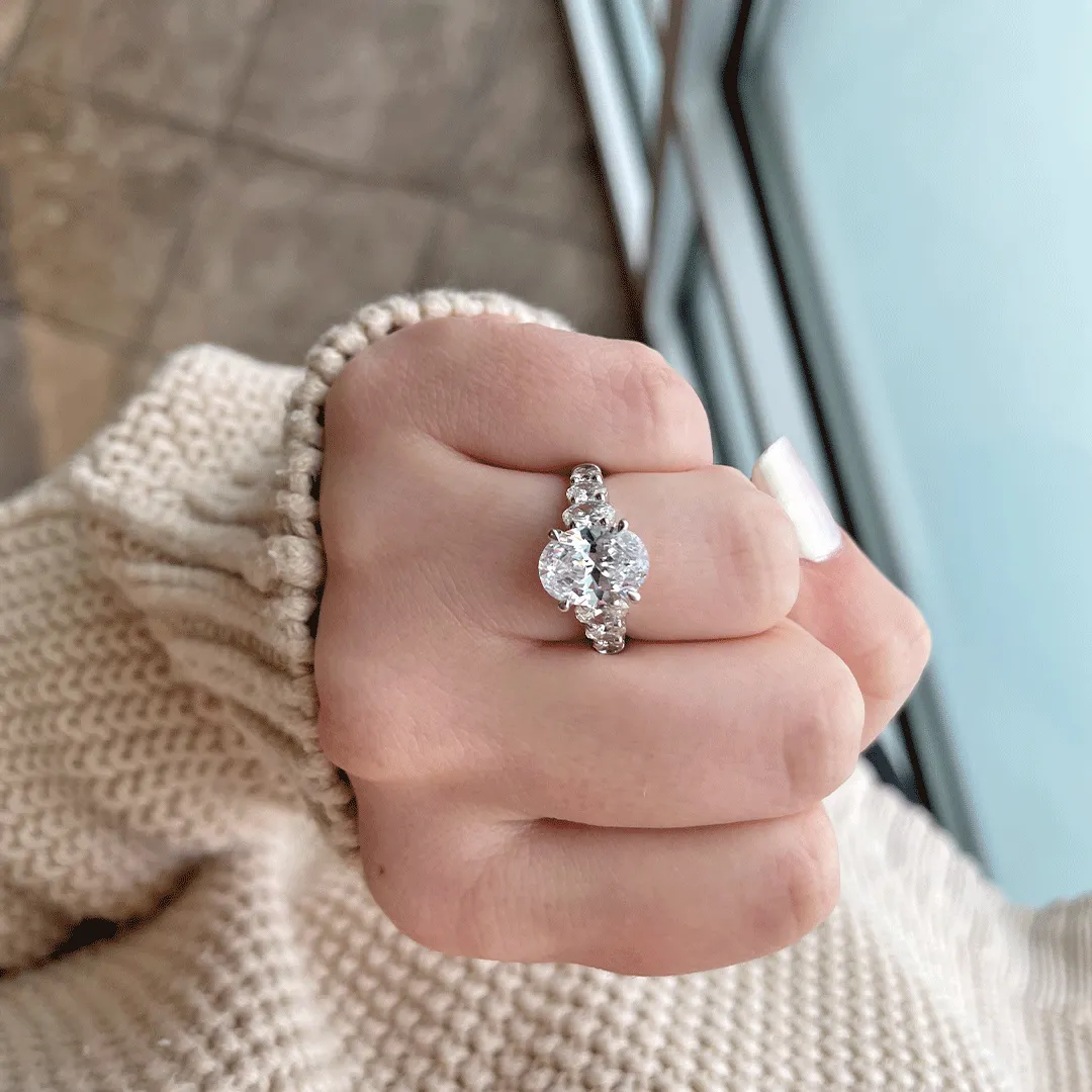 Classic Four Prong Oval Cut Diamond Flanked Engagement Ring